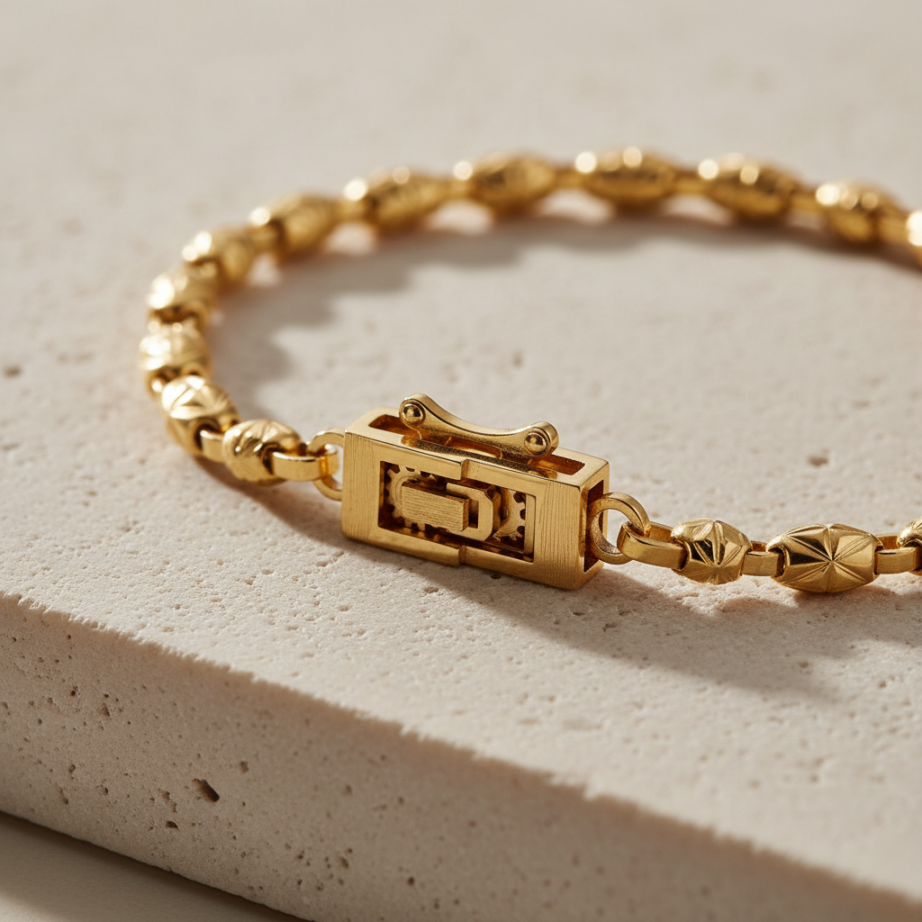 A meticulously detailed close-up of an anti-tarnish gold bracelet clasp and chain resting on a matte stone-textured surface in pale sand tones. The image focuses on the clasp mechanism and the tiny engraved facets of each link, all spotless and glowing, hinting at engineering and durability. Fine hairline reflections dance along the metal, captured under soft, directional studio lighting from the upper left, which creates a subtle gradient of light across the bracelet and a gentle shadow that anchors it. The background is minimal and neutral, softly blurred to keep all attention on the craftsmanship. Shot with extreme macro photographic realism, the composition highlights precision, reliability, and modern luxury, evoking a professional, aspirational brand detail shot.